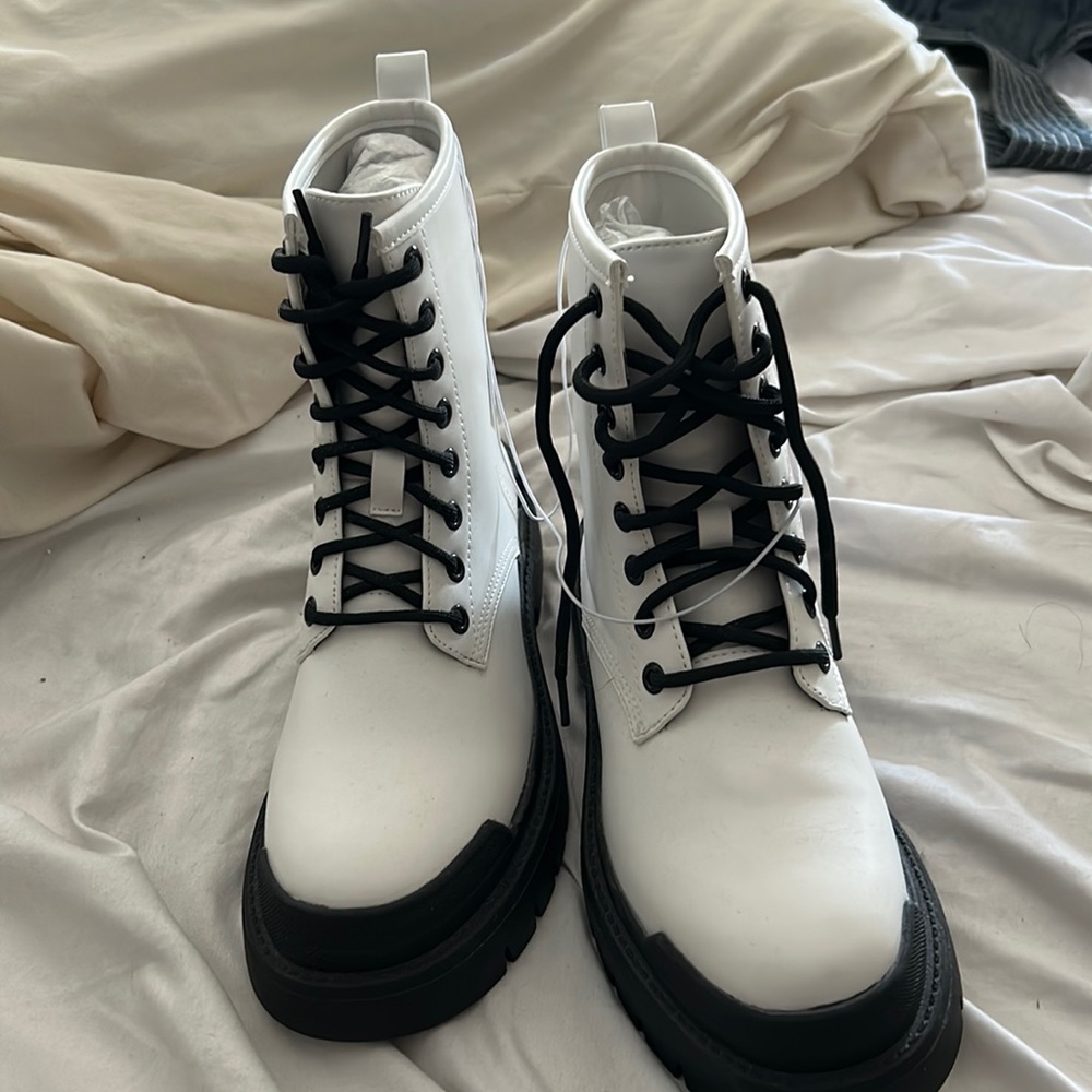 White with black dole boots. Never worn.